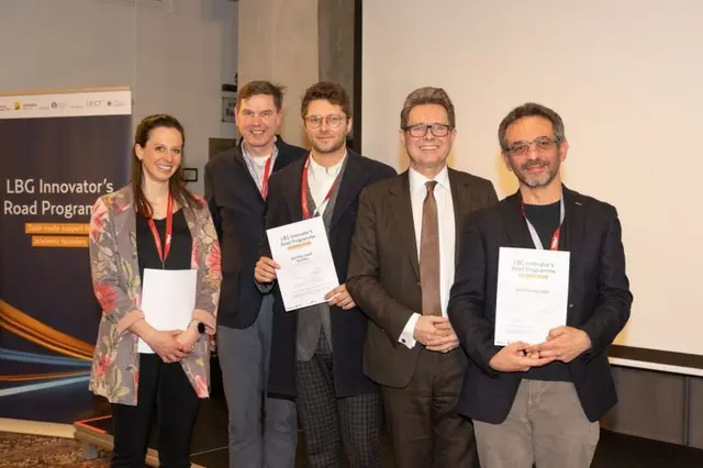 Five participants pose with their certificates in front of the LBG Innovator's Road Programme banner.