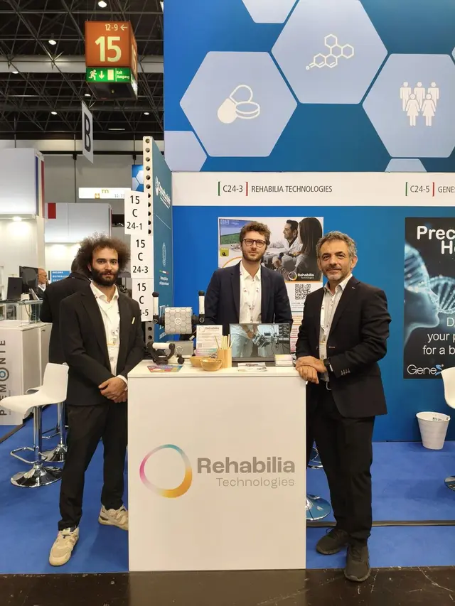 Three members of the Rehabilia Technologies team at their booth, C24-3 in Hall 15, at MEDICA 2025 in Düsseldorf.